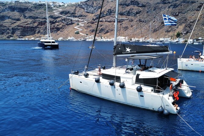 Half Day Premium Catamaran Cruise in Santorini Including Oia - Visiting the Venetian Lighthouse and Red Beach