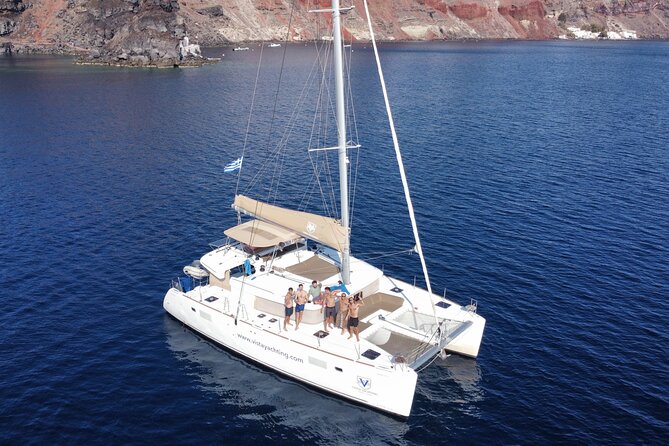 Santorini Gold Catamaran Cruise With Bbq, Drinks and Hotel Pickup - Meeting and Pickup