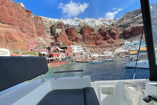 Half Day Premium Catamaran Cruise in Santorini Including Oia - Indulging in the BBQ Dinner and Open Bar