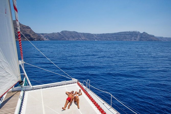 Sailing Catamaran Cruise in Santorini With Bbq, Drinks and Transfer - Swim at Hot Springs, Red Beach, and White Beach