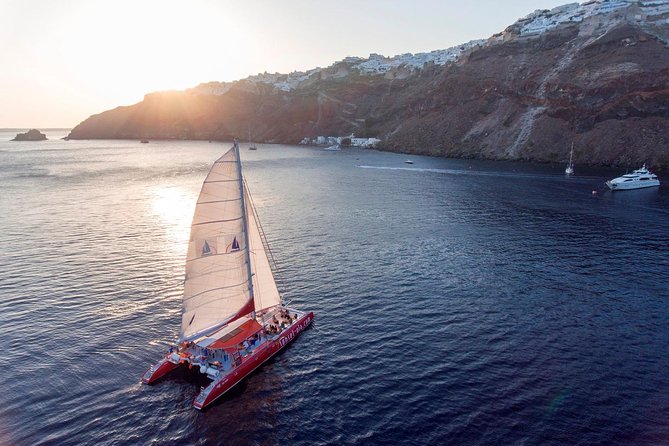 Sailing Catamaran Cruise in Santorini With Bbq, Drinks and Transfer - Onboard Amenities and Features