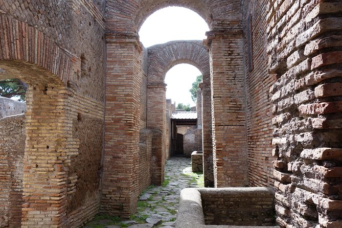 Ancient Ostia Antica Semi-Private Day Trip From Rome by Train With Guide - Preserved Structures in Ostia Antica