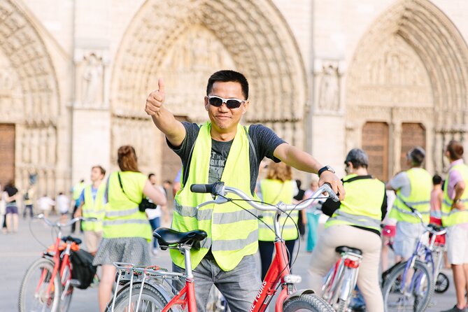 Paris by Night City of Lights Sightseeing Guided Bike Tour - Tour Logistics and Inclusions