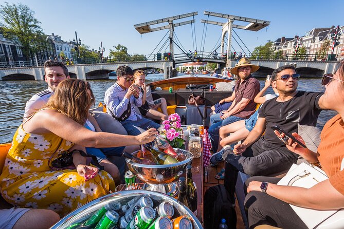 Amsterdam 1-Hour Canal Cruise With Live Guide - Seasonal Boat Accommodations