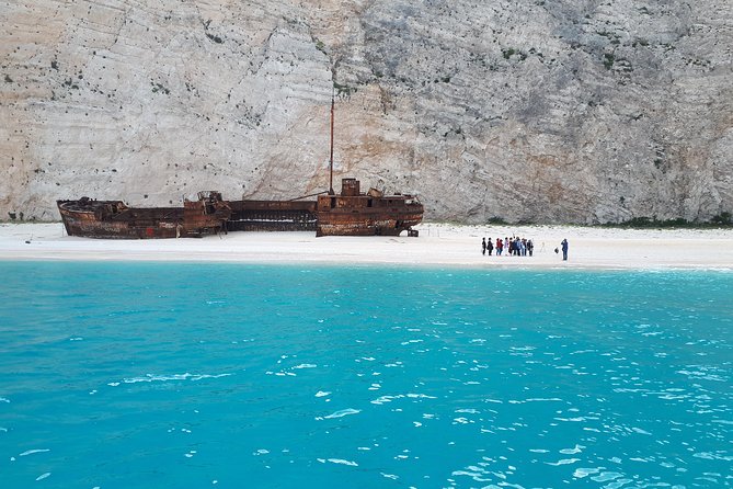 Zakynthos : One Day Small Group Tour to Navagio Beach Blue Caves & Top View - Swimming in Crystal-Clear Waters