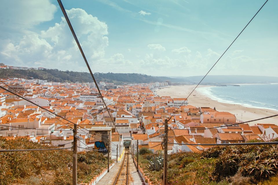 From Porto: Private Transfer to Lisbon With Stop at Nazaré - Overview of the Transfer