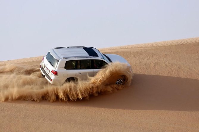 Private Sunrise Desert Safari BashingCamel RideSand BoardingInland Sea Visit. - Tour Overview