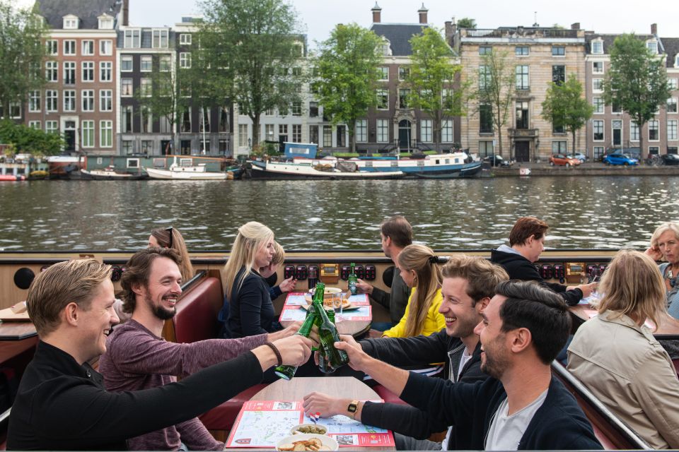 Amsterdam: Evening Canal Cruise With Pizza and Drinks - Experience Highlights