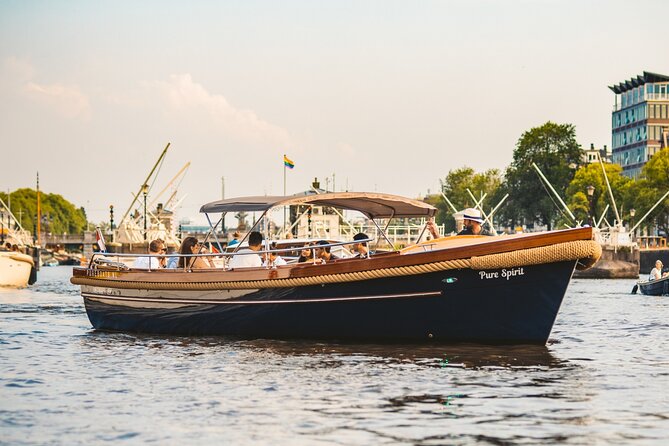 Amsterdam Small-Group Evening Canal Cruise Including Wine, Craft Beer, Cheese - Exploring Amsterdams Landmarks at Night