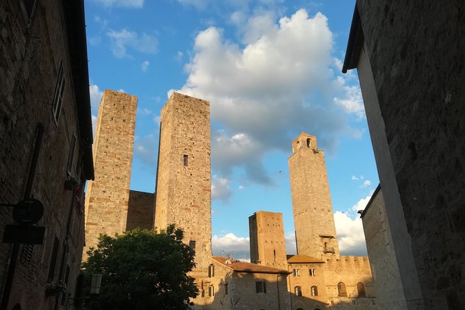 Small-Group San Gimignano and Volterra Day Trip From Siena - Cobblestone Alleyways and Tuscan Landscape