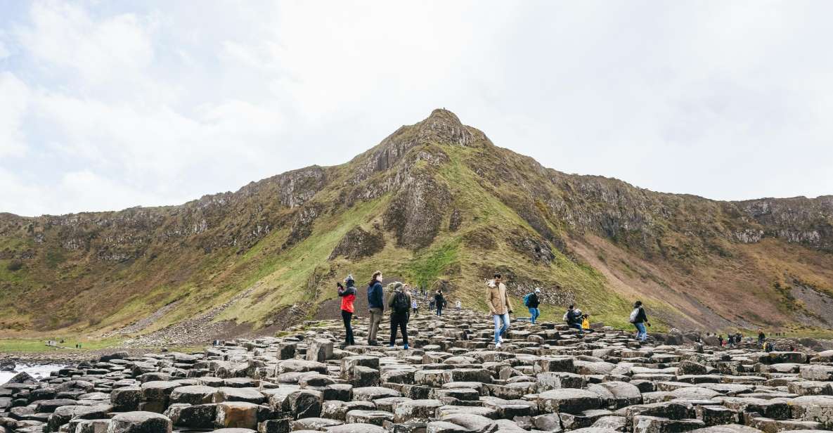 From Belfast: Giants Causeway Full-Day Guided Trip - Cushendun Caves and Carnlough Harbour