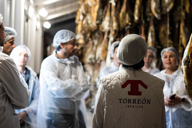 Private Visit to a Ham Factory With Show Cooking in Salamanca - Indulging in the Crunchy Sphere of Chorizo