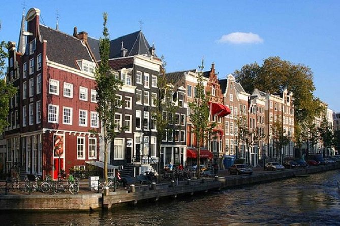 Secrets of Amsterdam Walking Tour Plus Dutch Sweets Tasting - Landmarks and Iconic Canals