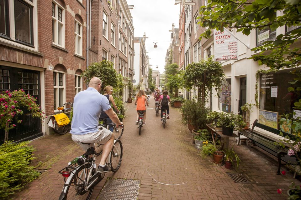 Amsterdam: Hidden Gems & Highlights Guided Bike Tour - Meeting Point & What to Bring