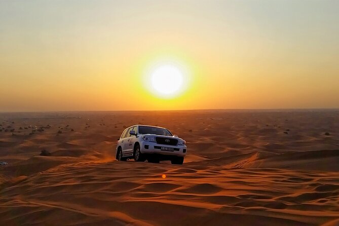 Desert Safari in 4x4 Car With BBQ Dinner and Belly Dance - Exhilarating Sand Boarding