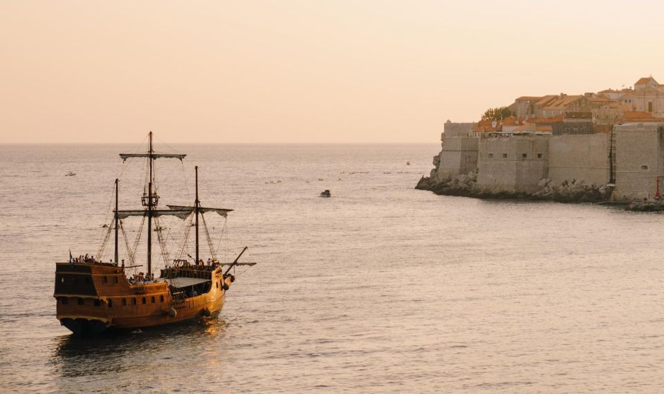 Dubrovnik: Galleon Cruise With a Live Show & Drink at Sunset - Onboard Amenities and Meeting Point