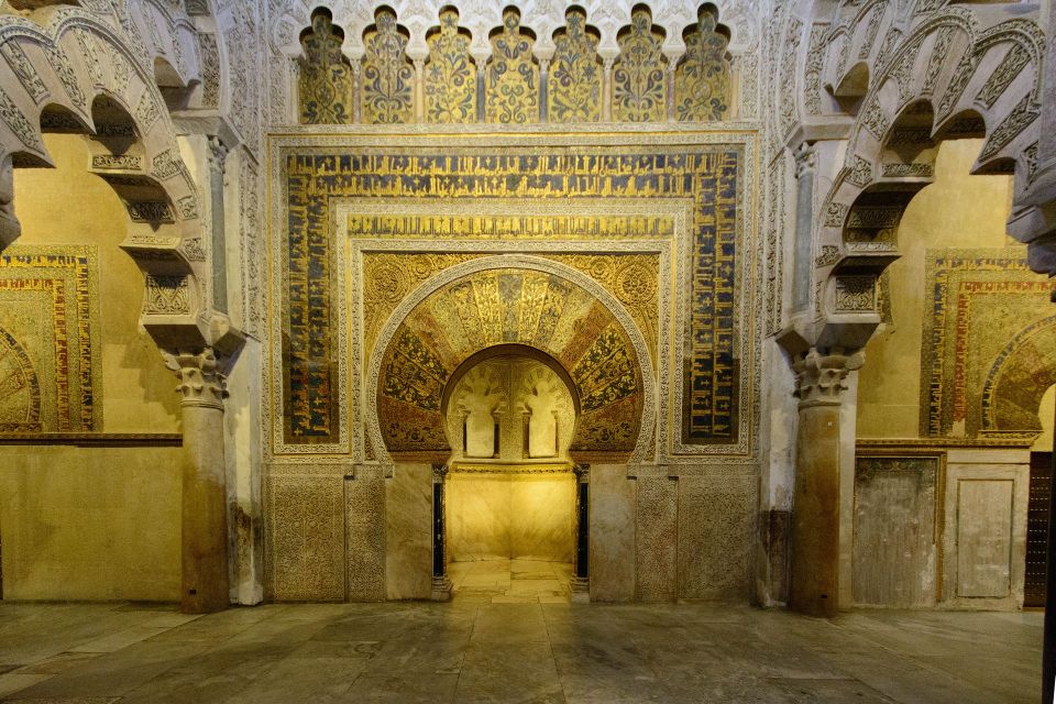 From Malaga: Private Guided Walking Tour of Córdoba - Crossing the Iconic Roman Bridge