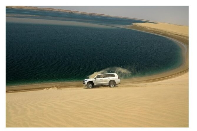 Half Day Desert Safari, Dune Bashing, Inland Sea & Sand Boarding - Sand Boarding Adventure