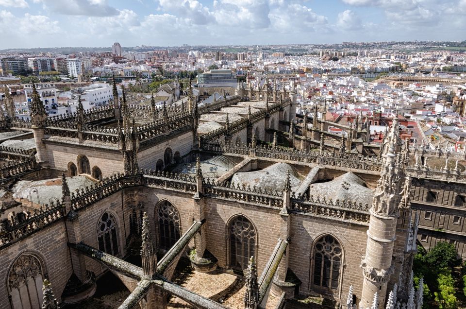 From Malaga: Seville Private Tour With Alcazar and Cathedral - Symbolic Giralda Tower