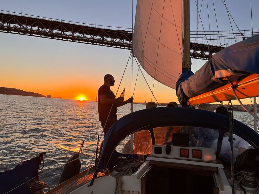 Lisbon: Sailboat Sunset Tour With a Drink - Language Support