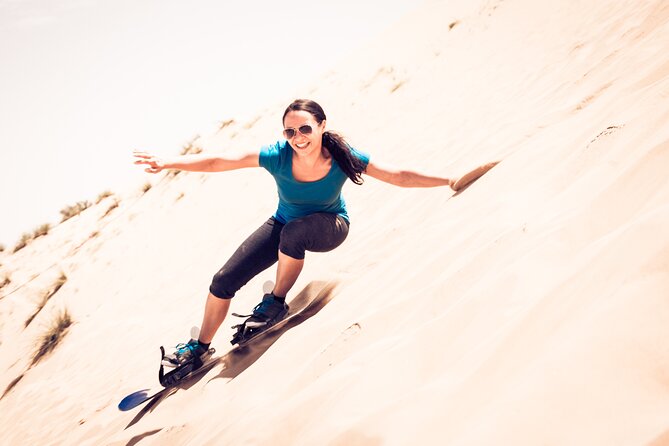 Desert Safari, Open Desert Quad Bike Experience With BBQ Dinner - Sandboarding and Camel Riding