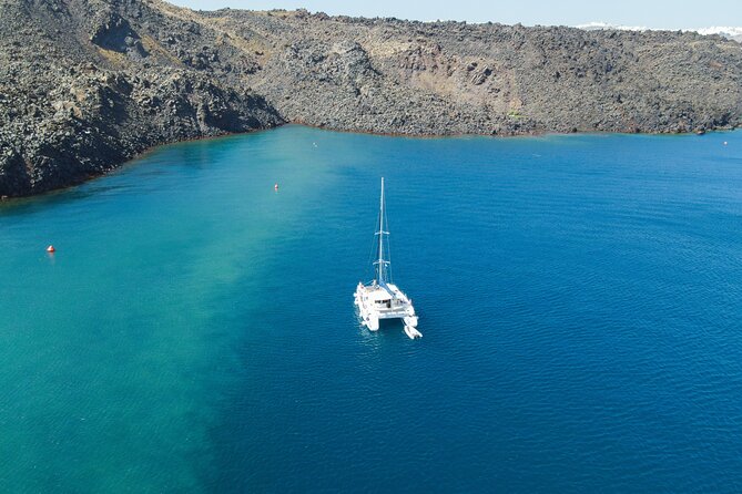 Full Day Santorini Catamaran Private Cruise With Meal and Transfer - Pricing and Booking Details