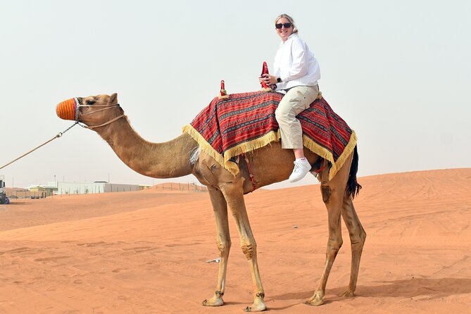 Morning Desert Safari, Quad Bike, Sandboard & Camel Ride - Sandboarding Down the Dunes