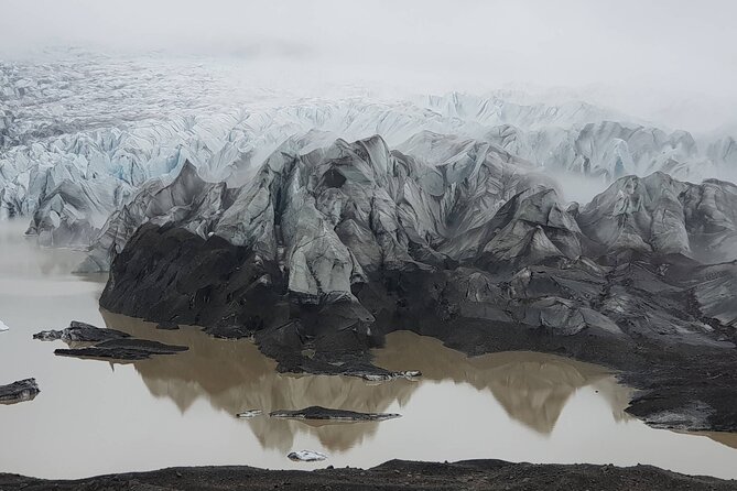 South Coast Waterfalls, Black Beach and Glacier Adventure Tour - Glacier Hiking Experience