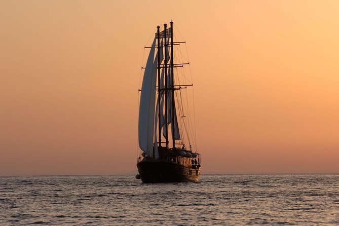 Santorini Caldera Sunset Sailing Cruise With Dinner and Wine - Volcano Exploration