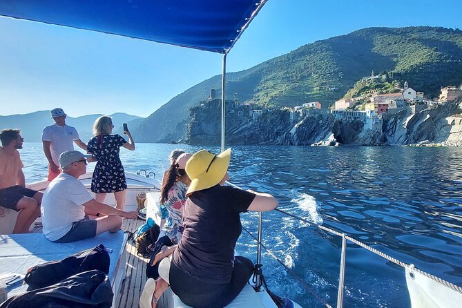 Sunset Cinque Terre Boat Tour With a Traditional Ligurian Gozzo From Monterosso - Enjoying Local Snacks and Beverages