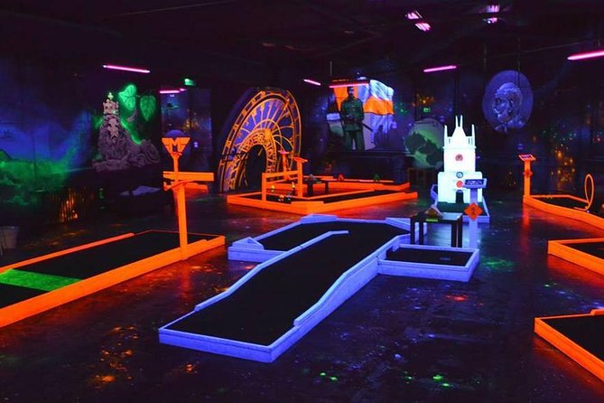 Prague Black Light Mini Golf and Games Tour Including Free Drinks - Key Points