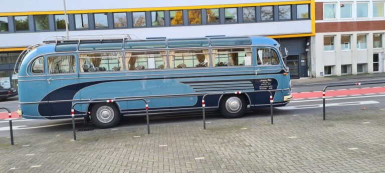 Cologne: Nostalgic Tour In German In Vintage Bus Tour Overview