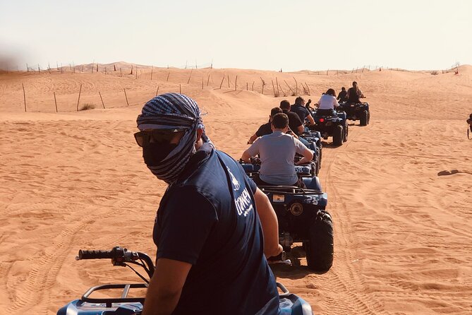 Dubai Red Dunes Quad Bike Tour,Sandboard, Camel Ride & BBQ Dinner - Tour Overview