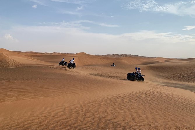 Dubai: Unique Sunset Quad Bike Red Dunes Safari Tour Overview