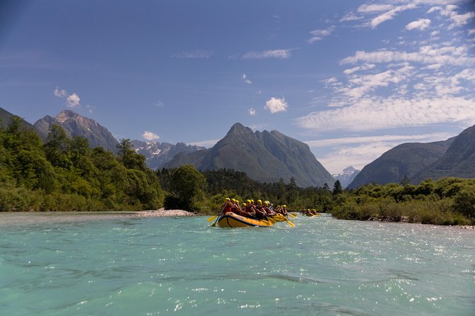 Family Rafting On Soca River Scenic Mountain Views