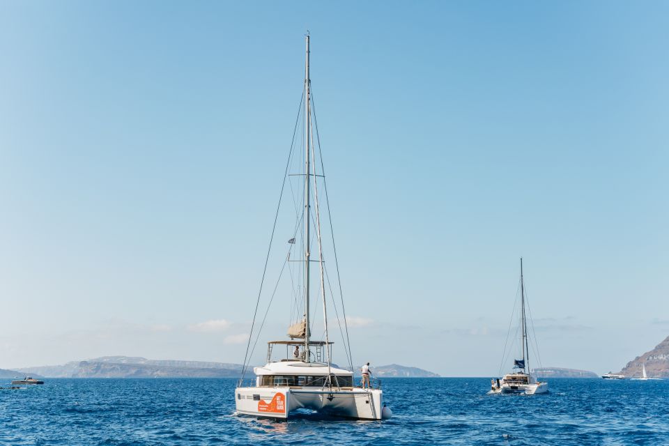 Santorini: Luxury Catamaran Day Trip With Meal and Open Bar - Tour Overview and Pricing