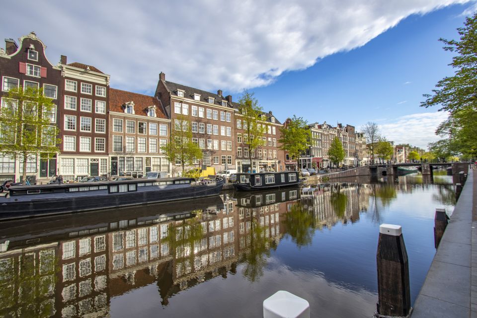 Amsterdam: Express Walk With a Local in 90 Minutes - Experience Highlights