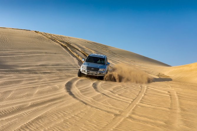 Doha Safari: Bash The Dunes, Camel Ride and Sandboarding - Camel Ride Through the Dunes