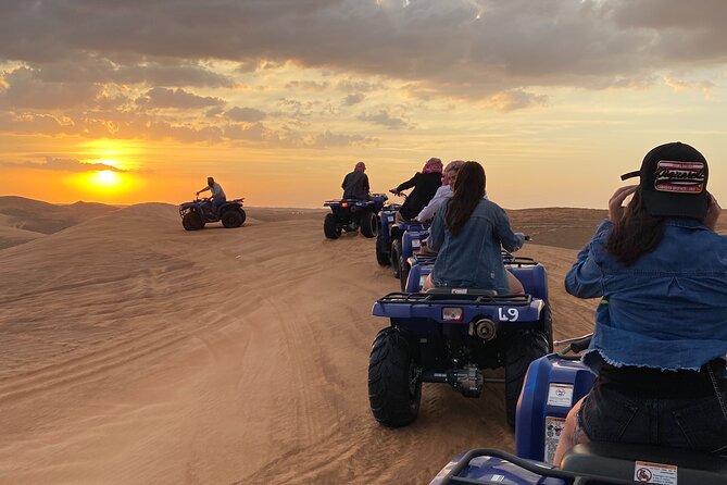 Dubai Red Dunes Quad Bike Tour,Sandboard, Camel Ride & BBQ Dinner - ATV Ride in Red Dunes