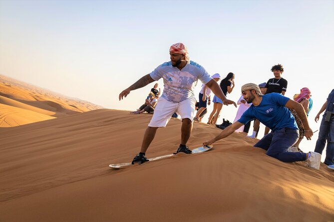 Dubai Red Dunes With Sandboarding, Camel Ride, Falcon & VIP Camp - Sandboarding and Camel Ride