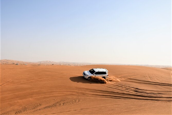 Premium Red Dunes Bashing With Quad Bike, Camel, Falcon &Vip Camp - Thrilling Quadbike Adventure