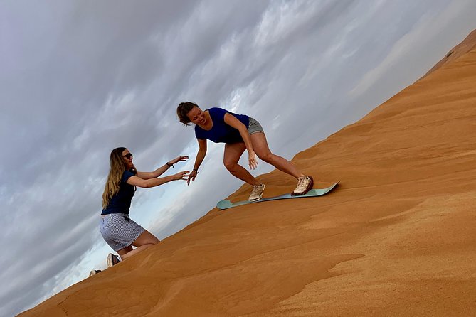 Dubai Red Dunes Quad Bike Tour,Sandboard, Camel Ride & BBQ Dinner - Camel Riding Experience