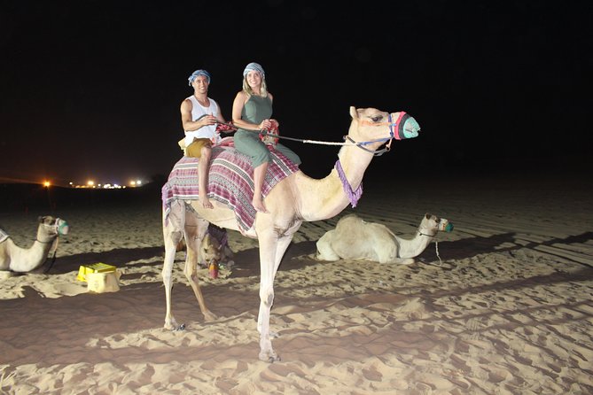 Evening Desert Safari on Red Dunes + Sandboarding + BBQ Dinner & Entertainment - Dune Bashing and Sandboarding