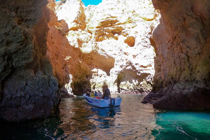 Ponta Da Piedade Boat Tour to Caves and Beaches With Local Guide - Discovering Scenic Caves