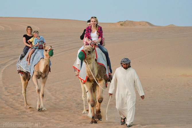 Red Dune Evening Desert Safari With BBQ Dinner and Camel Ride - Camel Ride Through Desert Landscape