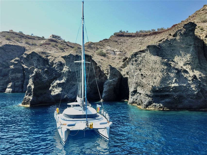 Santorini: Private Catamaran Excursion With Food and Drinks - Onboard Amenities and Inclusions