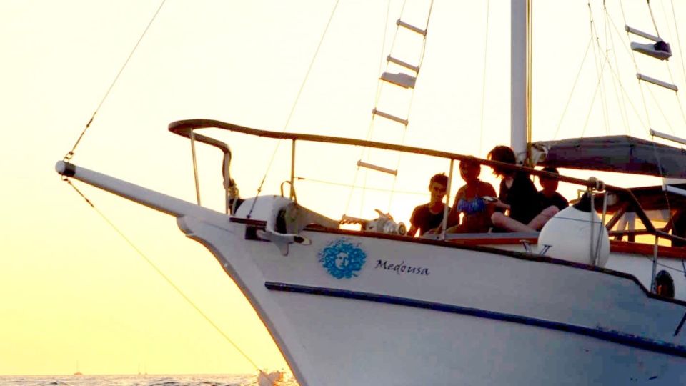 Santorini: Traditional Wooden Boat Tour With Meal and Wine - Food and Beverage