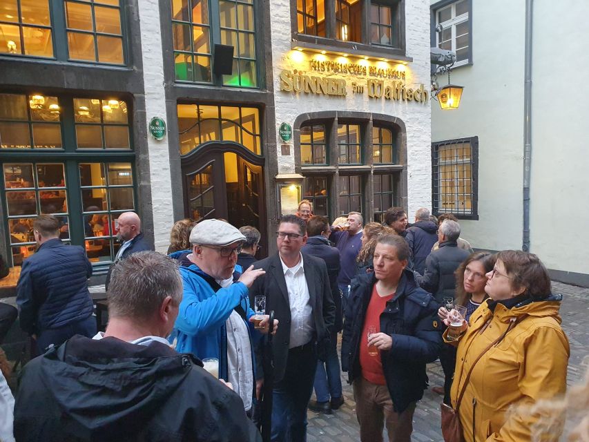 Cologne: Guided Walking Tour to 3 Old Town Breweries - Walking Through Colognes Old Town