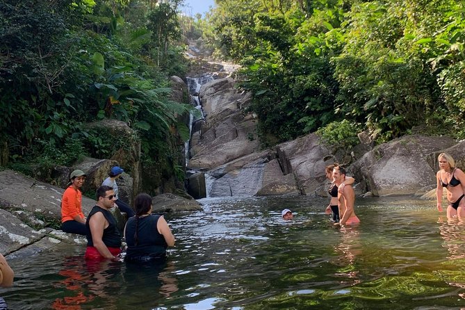 El Yunque: Waterslide, Waterfall, Shopping, and Beach Tour - Cascading Waterfall Sights