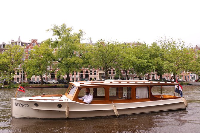 Private Guided Historic Amsterdam Canal Cruise in a Salon Boat - Confirmation and Guide Language